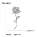 Elegante spilla a rosa d'argento con zirconi e perla, misura 7.2cm per 2.7cm - Argento