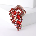 Vintage red crystal glass brooch with teardrop rhinestones on white geometric block - Red