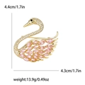 Elegante broche de cisne dorado con cristales de circón rosa e indicaciones de tamaño - Rosa