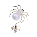 Elegant gold spider brooch with white pearls, zircon accents, and a black stone pendant - Gold