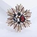 Starburst crystal glass brooch with red droplet stone and alloy diamond flower design - Purple (MM-BR-2557-Purple-PU)