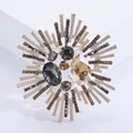 Detailed close-up of retro floral crystal brooch with champagne teardrop stone and alloy base - Champagne (MM-BR-2557-Champagne-CH)