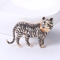 Vintage tiger brooch in gold plating with black enamel and green gemstone eyes - Gold