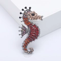 Exquisite seahorse brooch featuring colorful rhinestones on a vintage silver alloy base - Red