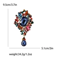 Vintage gouden broche met blauwe edelsteen en gekleurde kristallen met druppelhanger - Kleurrijk
