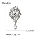 Elegante zilveren broche met sprankelende strass en kristallen waterdruppel hanger - Zilver