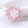 Detailed close-up of a flower brooch with pearls, pink gemstones, and zircon micro-paving - Pink