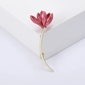 Detail of elegant magnolia flower brooch featuring deep pink enamel and gold-plated long stem - Red