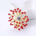 Spilla corallo rosso moda in lega dorata con resina e zircone centrale scintillante - Rosso