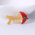 Cute fish bone brooch with vibrant red and yellow enamel finish and golden metal trim - Red