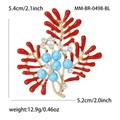 Elegante spilla a corallo con perle blu marmorizzate e accenti di cristallo per donna - Blu-0498-BL