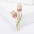 Elegant tulip brooch with colorful pavé cubic zirconia and gold plating on white stand - Pink