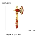 Spilla a forma di ascia dorata con strass rossi, misura 6,3cm x 2,7cm, peso 10,3g - Oro Rosso