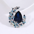 Eleganter sichelförmiger Kristall-Brosche mit birnenförmigem blauem Strassstein - Blau