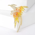 Vue détaillée d'une broche phénix avec ailes en émail orange et pierres de zircone incrustées - Jaune (MM-BR-8215)