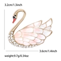Eleganter Schwan-Brosche aus Goldlegierung mit rosa Emaille-Flügeln und Kristallen - Rosa