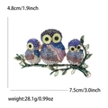 Detailed owl brooch with multi-color crystals and green enamel on a golden branch - Blue 2404-BL
