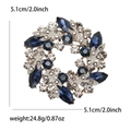 Silver alloy wreath brooch featuring navy blue rhinestones and 5.1cm diameter - Blue