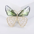 Elegante spilla a farfalla dorata con ali verdi sfumate e cristalli trasparenti brillanti - Verde