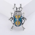 Luxurious blue and yellow enamel beetle brooch with crystals on a minimalist pedestal - Blue Insect Style (2401-Blue)