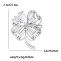 Elegant silver four-leaf clover brooch with sparkling cubic zirconia and dimensions - Silver