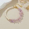 Close-up of baroque pearl and purple amethyst stone bracelet with heart pendant detail - Natural Pearl Amethyst