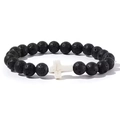 Close-up of 8mm black lava stone beads and a white cross charm on a beaded bracelet - Lava Stone With White Cross