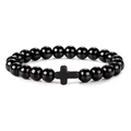 Close-up of 8mm polished black beads bracelet with a matte black cross charm detail - Black Agate