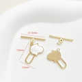 Detailed view of 18k gold plated Hamsa hand charms and OT toggle clasp with mother of pearl - 18K Gold Hamsa Hand Style