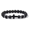 Close-up of black lava stone beads with a religious cross pendant and silver spacers - Lava Stone With Black Cross