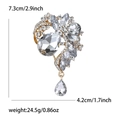 Luxurious alloy floral brooch with sparkling crystals and pear-shaped drop in gold finish - Gold