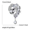 Elegant silver alloy brooch with crystal rhinestones and teardrop pendant, 7.3x4.2cm size - Silver
