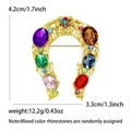 Colorful horseshoe brooch with crystal rhinestones in gold finish measuring 4.2cm by 3.3cm - Gold (MM-BR-2827)