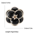 Black enamel camellia flower brooch with gold trim measuring 3.6cm by 3.4cm - Black