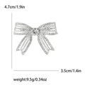 Spilla a fiocco argento con perle e strass, misura 4,7 x 3,5 cm con un peso di 9,5 g - Argento