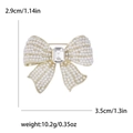 Elegant gold bow brooch with white faux pearls and a large rectangular crystal - Gold (MM-BR-2900-Gold-GD)