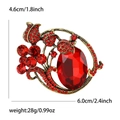 Elegante spilla a fiore vintage con grande cristallo rosso e petali floreali in bronzo - Rosso