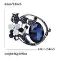 Spilla vintage con grande cristallo blu scuro e design floreale in tonalità argento - Blu Inchiostro