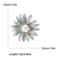Detail showing blue daisy brooch with pearl center and 3.6cm gold-edged petals - Blue