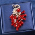 Vintage gold peacock brooch with white cubic zirconia and red water-drop resin beads - Red