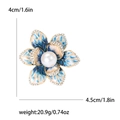 Elegant gold flower brooch with blue enamel petals, white pearl center and crystals - Blue