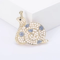Vintage snail brooch with white pearls and blue crystals on a golden metal base - Gold