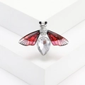 Macro shot of silver bee brooch with large crystal drop and red translucent wings - Silver Base Red