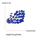 Broche de pavo real con diamantes azules y metal dorado con medidas de 4,4x6,5cm - Azul