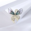 Broche papillon élégante en acrylique avec design doré évidé et strass blancs brillants - Violet
