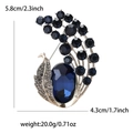Broche de pavo real vintage en oro con cristal ovalado azul oscuro y strass pequeño - Azul