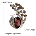 Broche de pavo real vintage dorado con cristales marrones y dimensiones para damas - Morado
