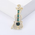 Eleganter goldener Violinen-Anstecknadel mit weißen Strasssteinen und grünen Kristallen - Grün