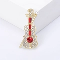 Eleganter goldener Violinen-Anstecker mit weißen Diamanten und roten Zirkonia - Rot