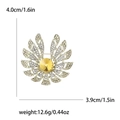 Gouden bloemspeld met gele steen en witte strass steentjes, details van 4,0 cm groot - Geel